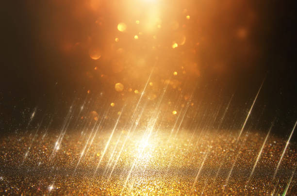 istock glitter vintage lights background. black and gold. de-focused. 1047053894