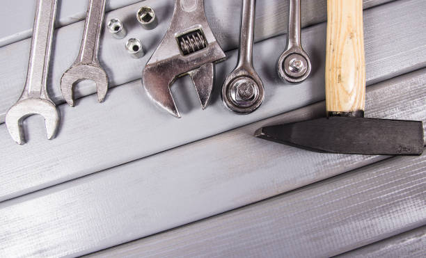 istock Top view of working tools on wooden background. Construction concept. 1047054084