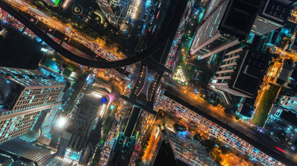 istock Junction road intersection in urban downtown at night for transportation or traffic concept background. 1047054192
