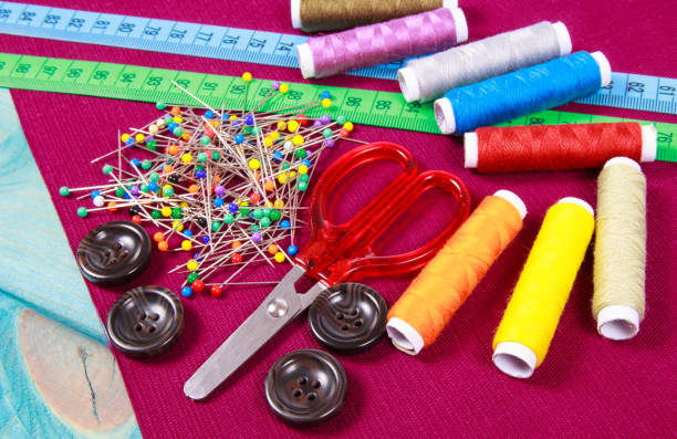 istock Supplies and accessories for sewing - scissors, threads, pins, buttons, centimeter. 1047054948