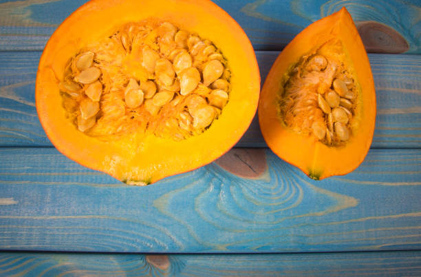 istock Pumpkins on rustic blue background. Autumn background. 1047057620