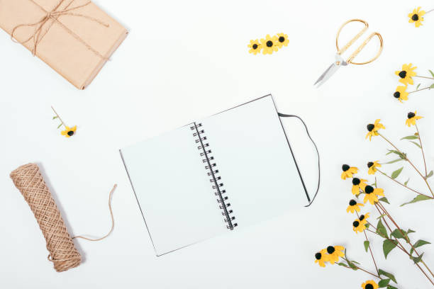 istock Rustic florist flat lay composition with empty sketchbook in center 1047057936
