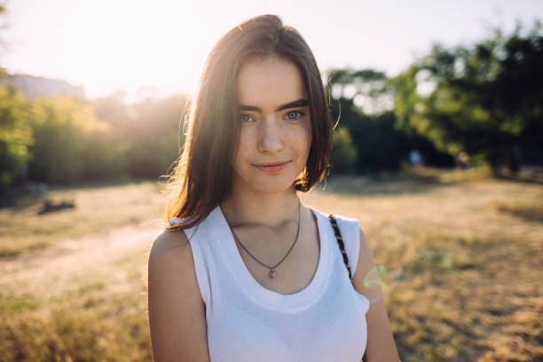 istock Female smiling calmly and looking at camera 1047058028