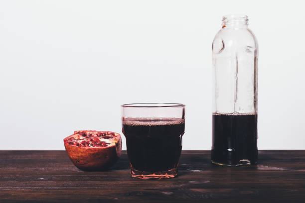 istock Freshly prepared pomegranate juice in glass 1047058170
