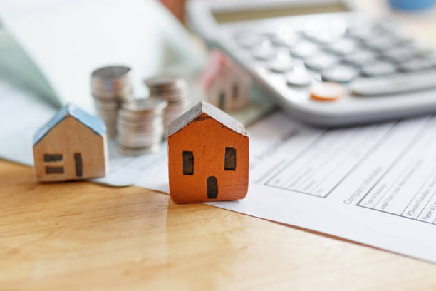 istock Home insurance form with money,passbook  and calculator. 1047059212