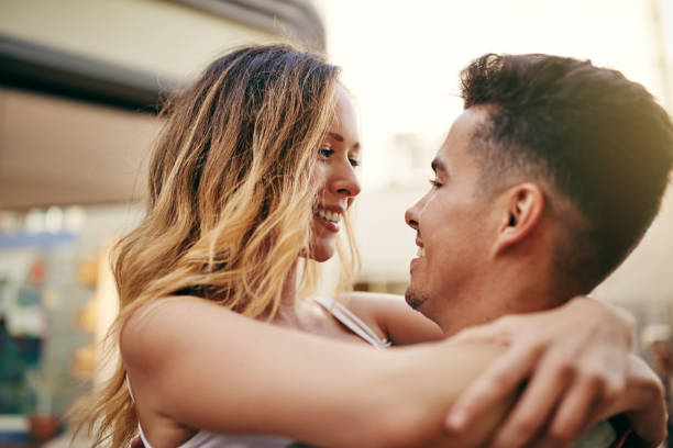 istock Affectionate young couple sharing a moment together in the city 1047059238