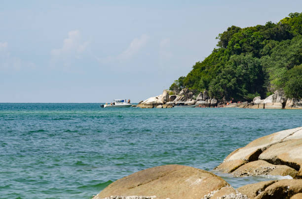 istock Beautiful tropical beach at sunny day with blue sky background 1047062070