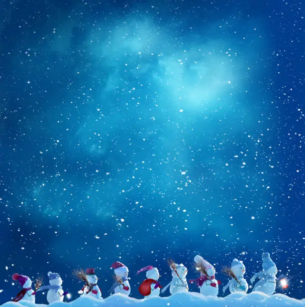 Photo of Merry Christmas and happy New Year greeting card with copy-space.Many snowmen standing in winter Christmas landscape.Winter background
