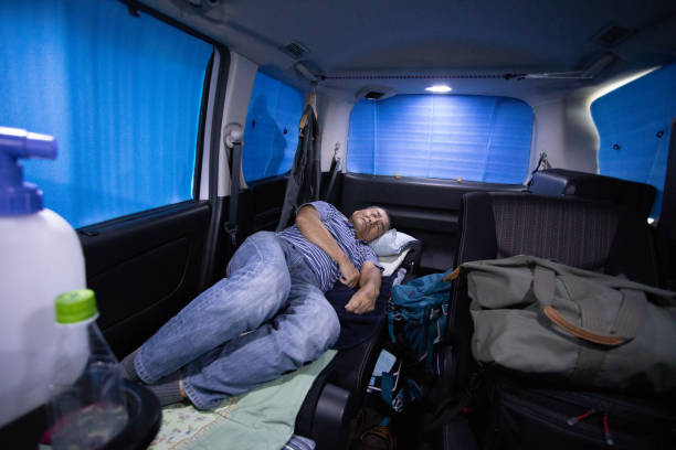 istock Senior man sleeping in his car 1047064690