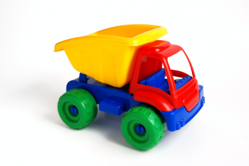 Toy truck with crane isolated on blue background