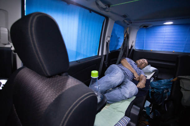 istock Senior man sleeping in his car 1047070922