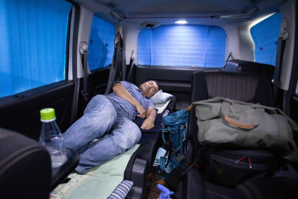istock Senior man sleeping in his car 1047071632