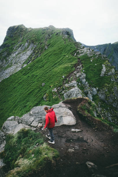 istock Hiker in red jacket on Lofoten Islands 1047079966