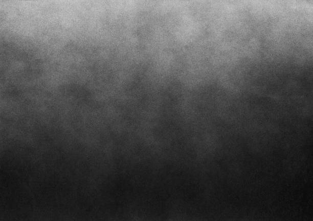 istock Subtle grain texture. Abstract black and white gritty grunge background. Dark paint spray particles on paper 1047083362