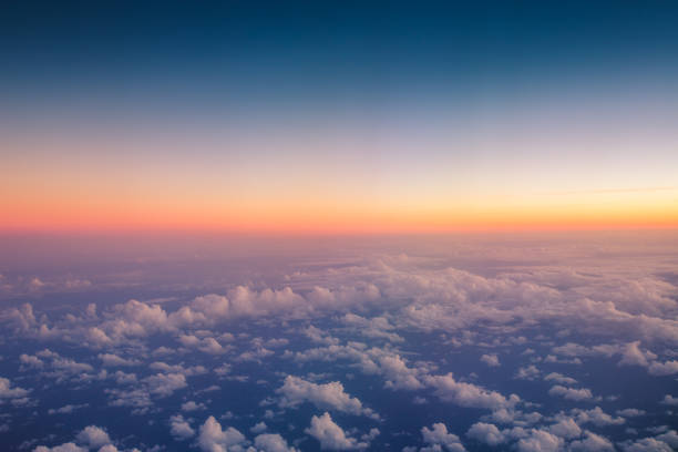 istock Flying above the clouds. Aerial view from the airplane window 1047083604