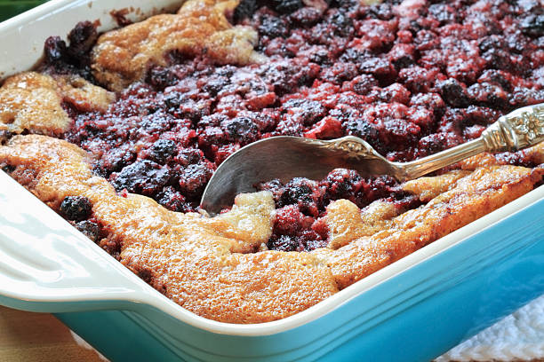 istock Blackberry cobbler in a blue serving dish with antique spoon 104708622