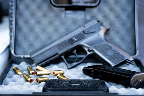 istock Close up view of bullets and handgun. 1047089364