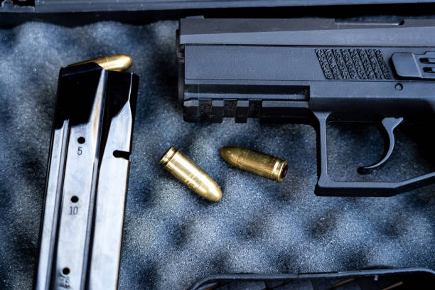 istock Close up view of bullets and handgun. 1047090614