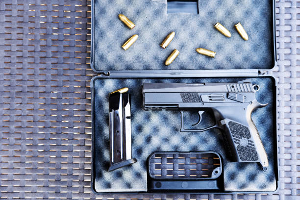 istock Top view of bullets and handgun. 1047095076