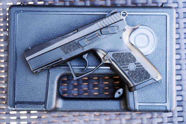 istock Top view of bullets and handgun. 1047095090