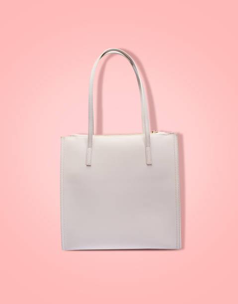 istock Handbag isolated on pink background 1047095972
