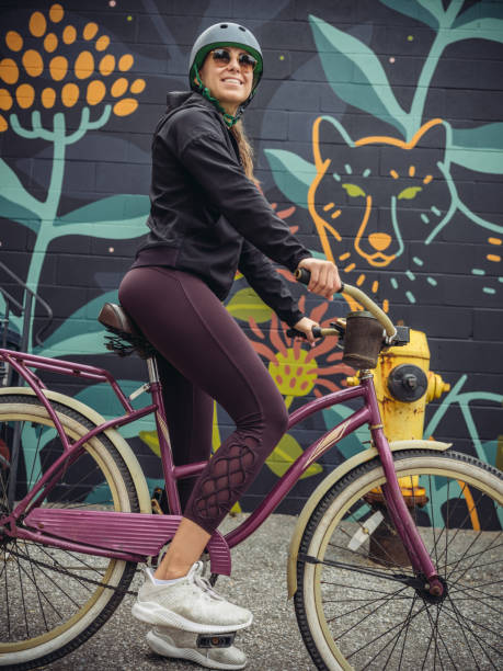 istock Young woman on cruiser bicycle 1047098790