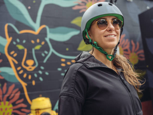 istock Young woman on cruiser bicycle 1047099128