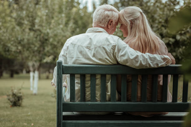 istock Relaxed mature people having rest in park 1047102066