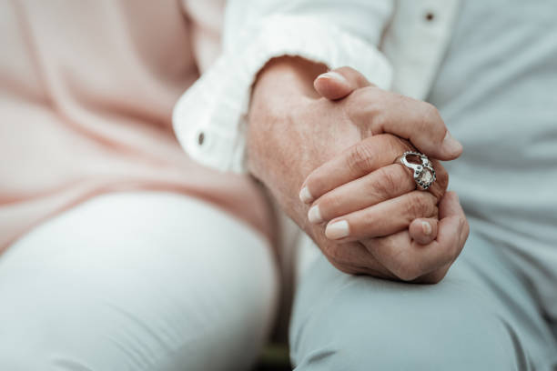 istock Close up of male hand that holding tiny palm 1047102082
