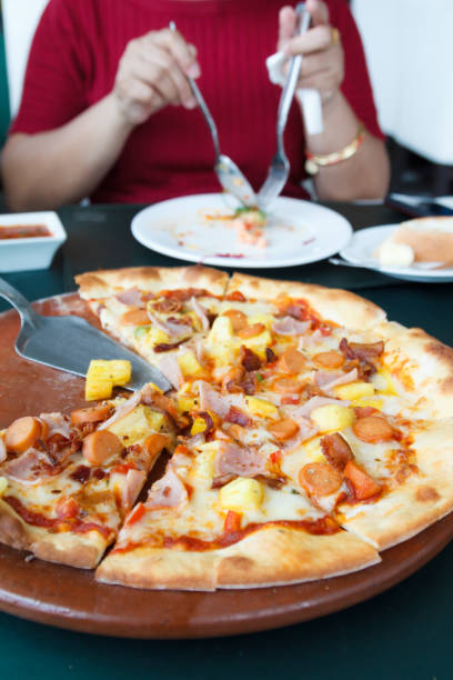 istock slices of Pizza in restaurant 1047102290