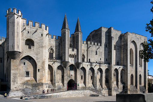 Palais des Papes in the city of Avignon, France in the department of Vaucluse on the left bank of the Rhone River. Once a fortress and palace, the papal residence was the seat of western Christianity during the 14th century. Since 1995, the Palais des Papes, along with the historic center of Avignon, is a UNESCO World Heritage Site.