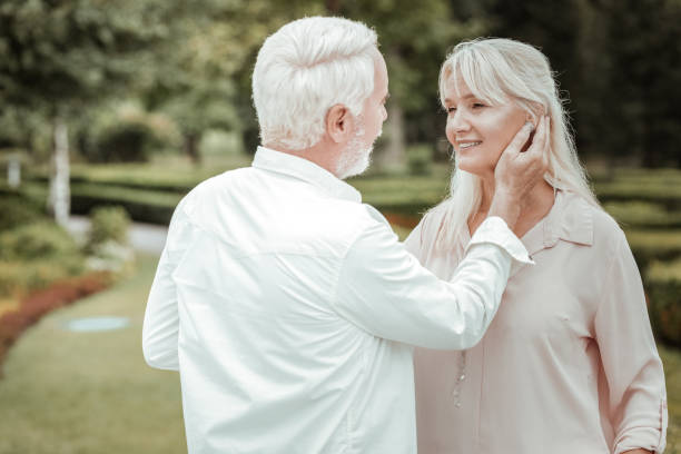 istock Pretty retired woman looking at her husband 1047109122