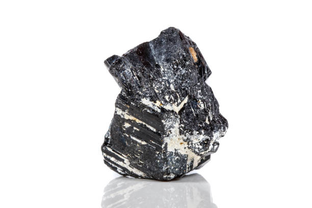 istock macro mineral stone sherle, schorl, black tourmaline on white background 1047113072