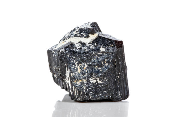 istock macro mineral stone sherle, schorl, black tourmaline on white background 1047113096