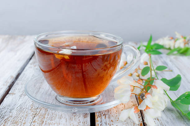 istock Acacia tea close up on wooden tables 1047115292