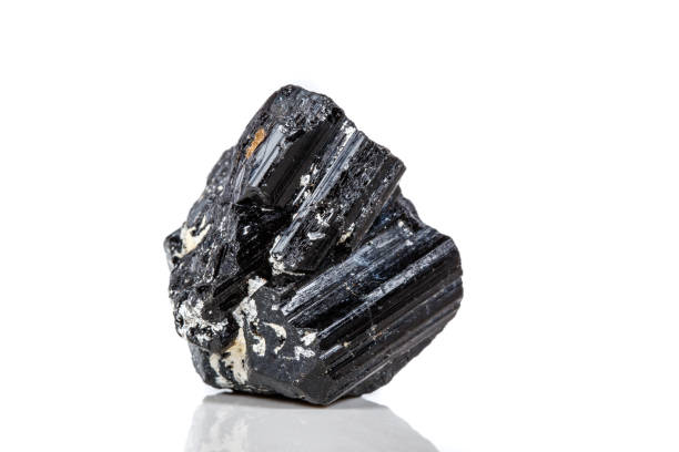 istock macro mineral stone sherle, schorl, black tourmaline on white background 1047115614