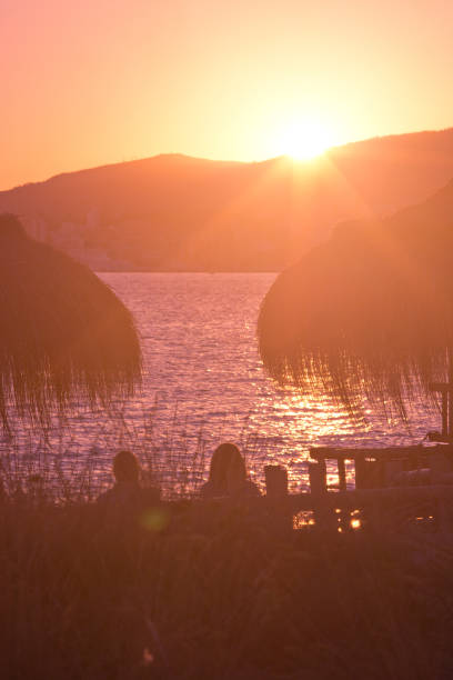 istock Golden sunshine at sunset on a beautiful beach afternoon 1047115886
