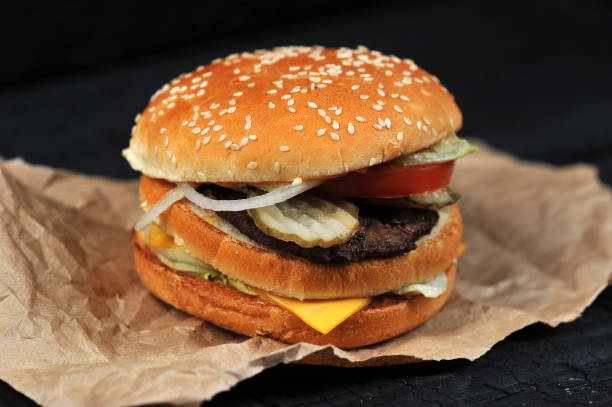 istock fast food Burger with cheese and beef 1047116424