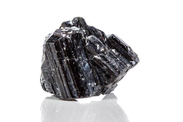 istock macro mineral stone sherle, schorl, black tourmaline on white background 1047116440