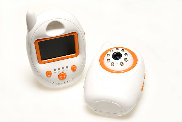 Two orange and white baby monitors stock photo