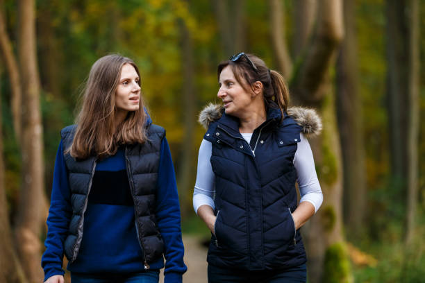 istock People walking in city park 1047121186