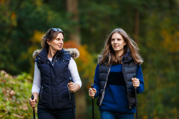 istock People nordic walking in city park 1047121596