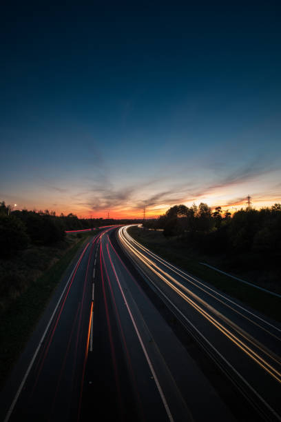 istock Headlights and Taillights on Motorway at Night in UK 1047121950