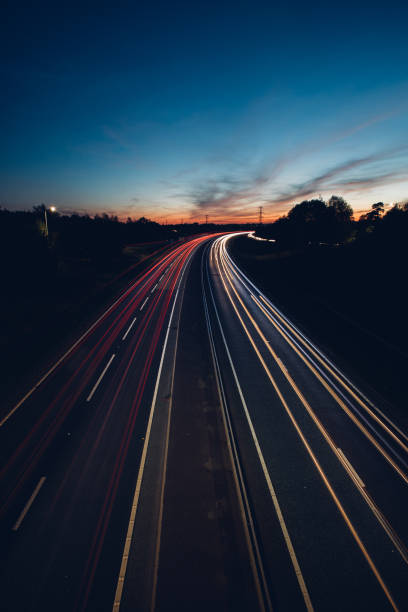 istock Headlights and Taillights on Motorway at Night in UK 1047122168