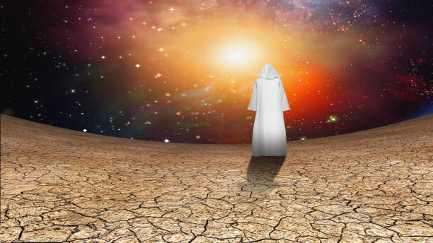 istock Desert and galactic sky with wandering cloaked figure 1047122250