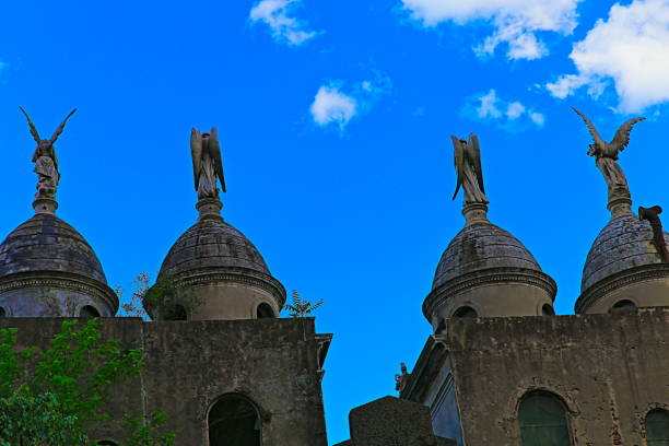 istock Angels above mausoleuns against blue sky pattern - Recoleta cemetery – Buenos Aires 1047123366
