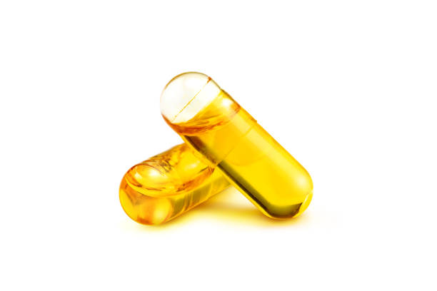 istock Fish oil supplement capsules isolated on white background 1047129706