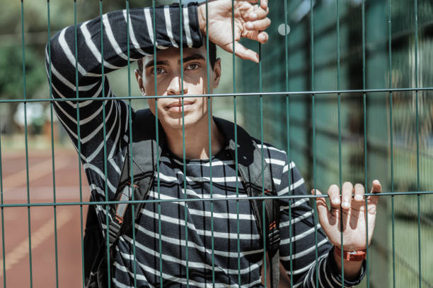 istock Serious concerned guy wanting play on playground 1047129786