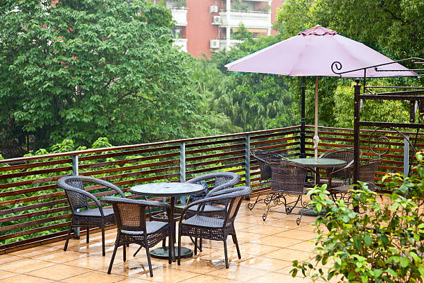 Armchairs and a cafe table on a hotel balcony
