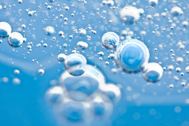 istock Bubbles of oxygen under water. Water blue structure. Macro. 1047136112